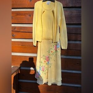 Women’s skirt/sweater set. Floral detail with beading. Skirt size 8 petite.